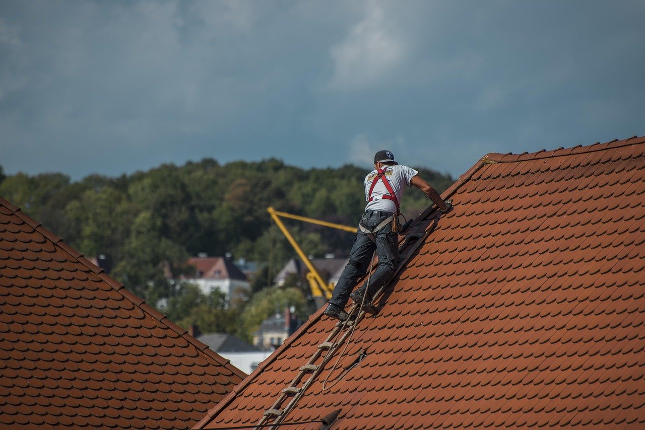 a man climbing on a roof